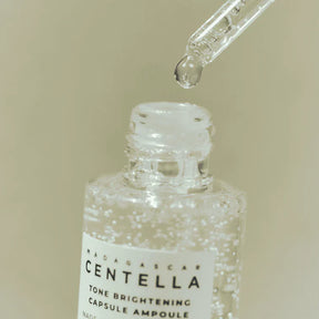 SKIN1004_MADAGASCAR_CENTELLA_TONE_BRIGHTENING_CAPSULE_AMPOULE_SKIN1004_-_Ampola_Iluminadora_com_C_psulas_de_Centella_Madagascar_100ml_skin1004_koumitwo